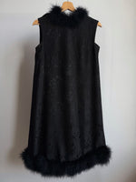 Tailored black dress with real feathers