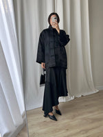 Asymmetrical black midi skirt