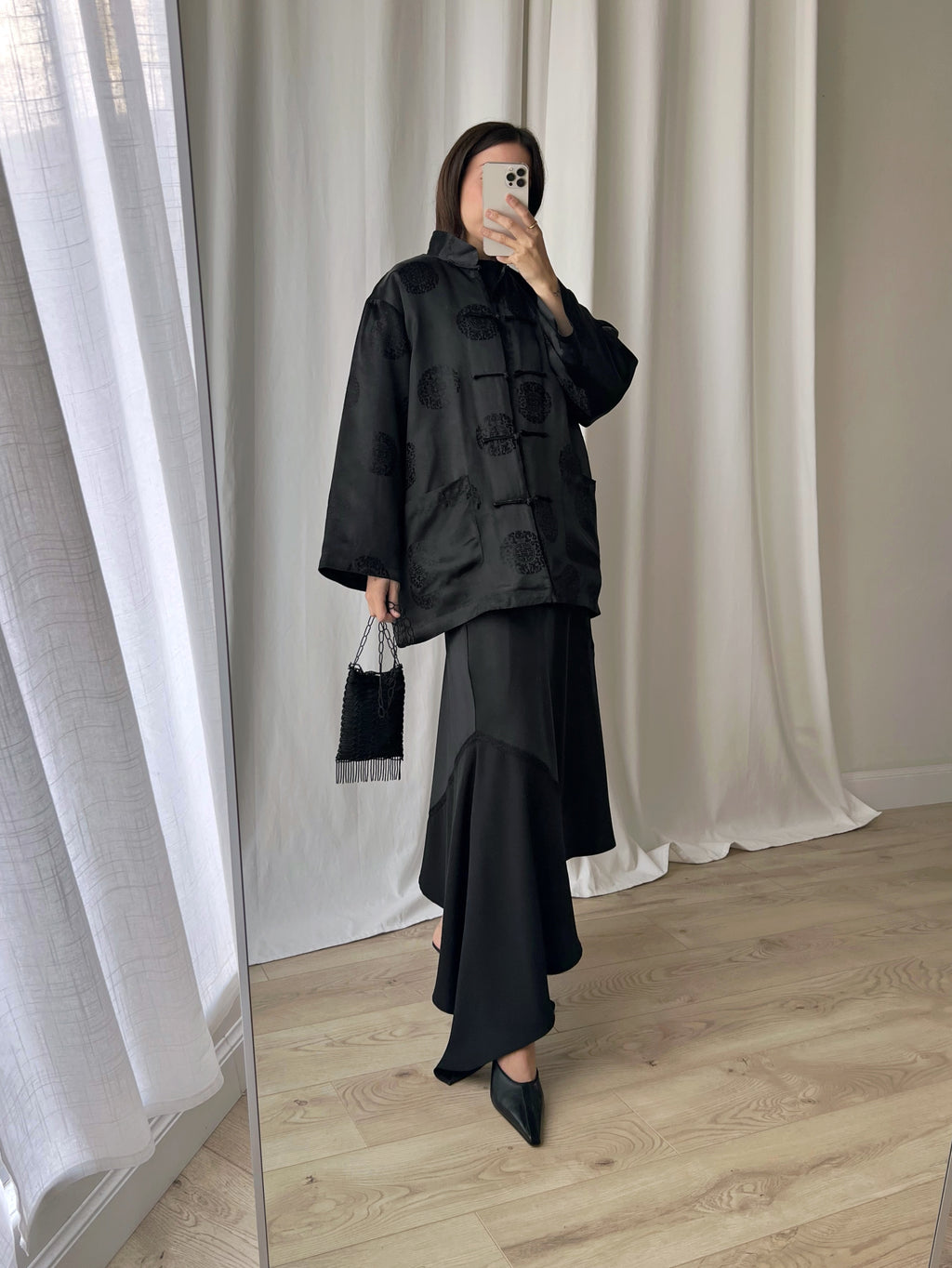 Asymmetrical black midi skirt