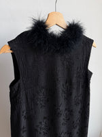 Tailored black dress with real feathers
