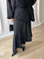 Asymmetrical black midi skirt