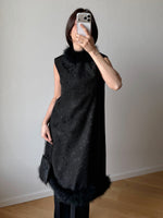 Tailored black dress with real feathers