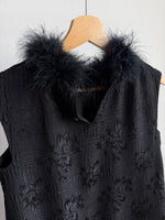 Tailored black dress with real feathers