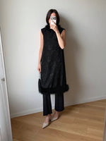 Tailored black dress with real feathers