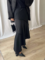 Asymmetrical black midi skirt
