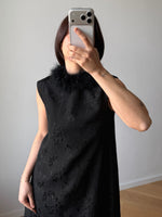Tailored black dress with real feathers